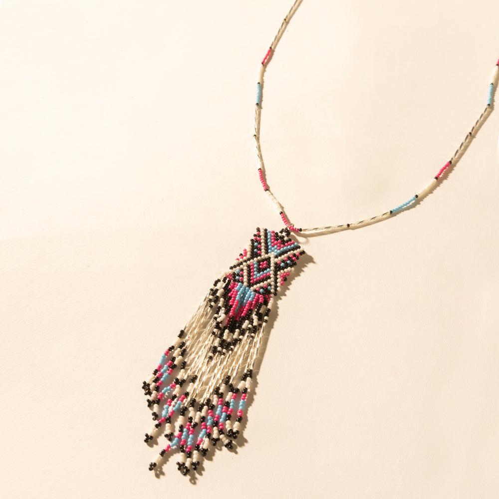 Myra Sky and Coral in necklace in Turquoise