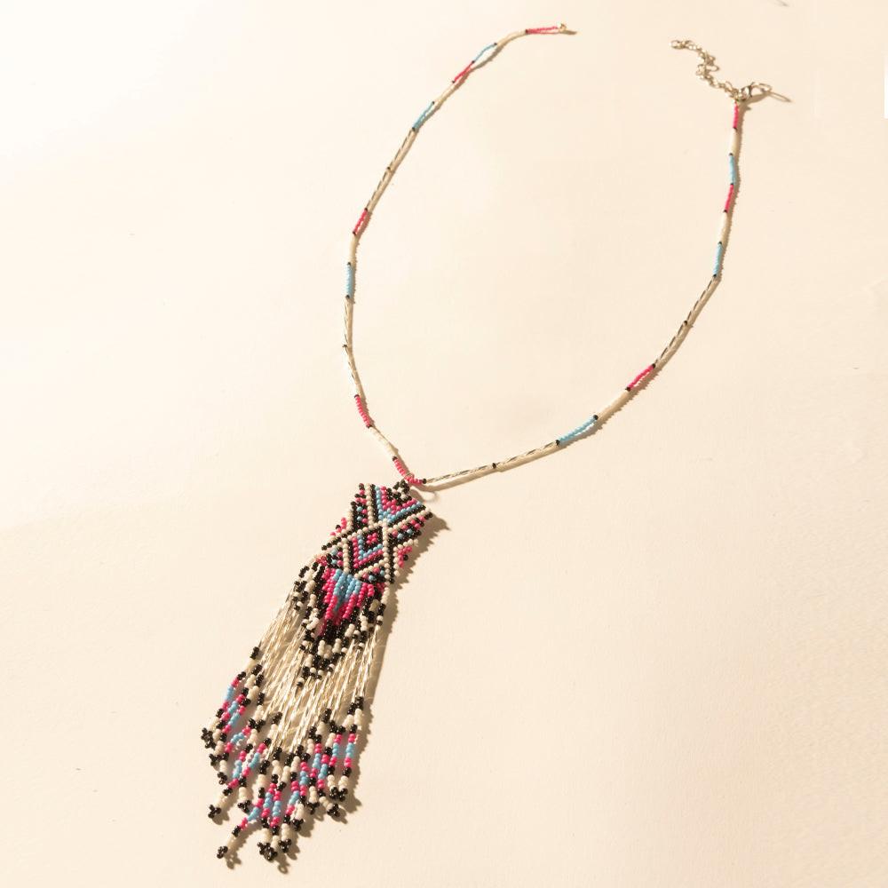 Myra Sky and Coral in necklace in Turquoise